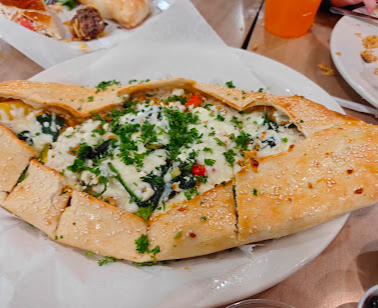 Mediterranean Deli, Bakery & Catering signature dishes Chicken Gyro Platter
Mediterranean Style Grilled Salmon
Pistachio Baklava
